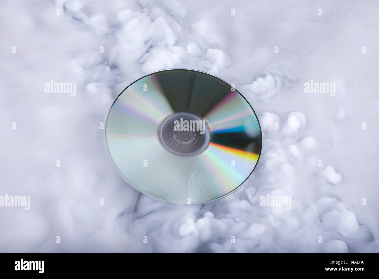 Compact disk in the clouds. Conceptual image. Sound cloud Stock Photo