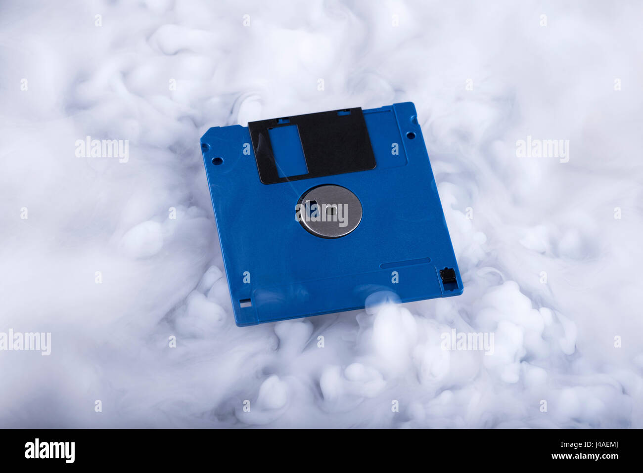 Floppy disk Retro information storage. Information cloud. Conceptual Stock Photo