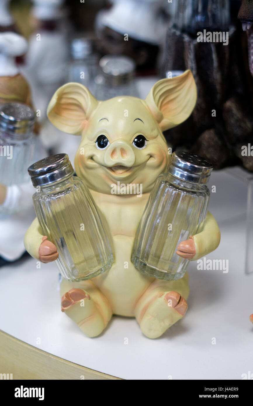 A pig shaped salt and pepper holder for sale at Gizmos & Gadgets at the Tanger Outlet Mall in Deer Park Long Island, New York. Stock Photo