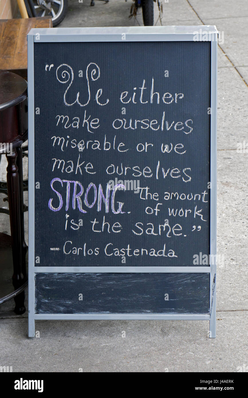 A quote from Carols Castenada encouraging people not to be miserable but to be strong. In Greenwich Village, New York City. Stock Photo