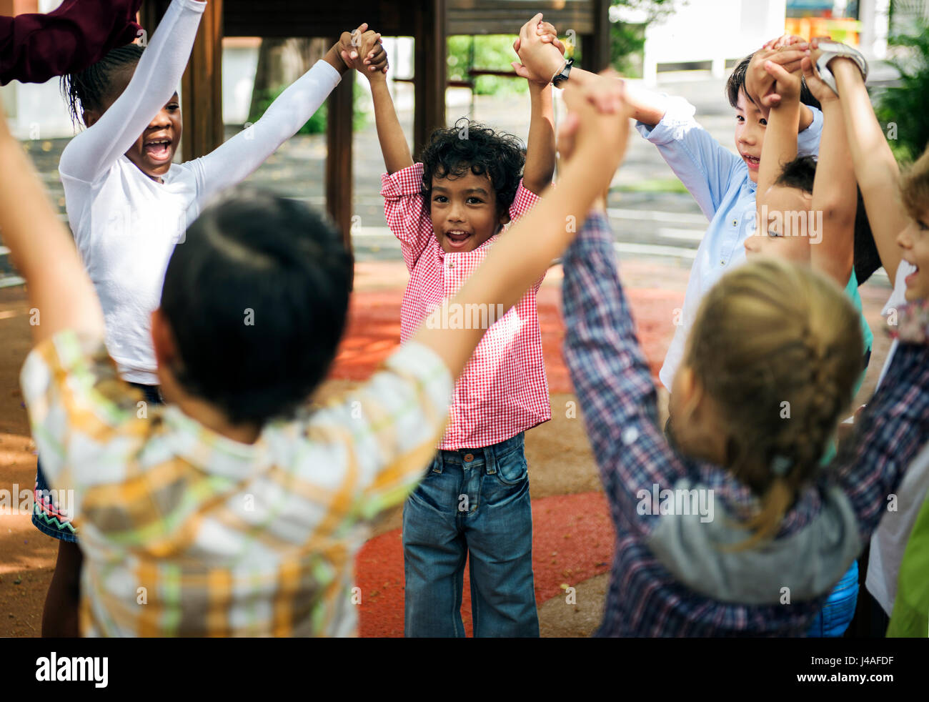  Group of diverse kindergarten students hands up together Stock Photo Motiv 