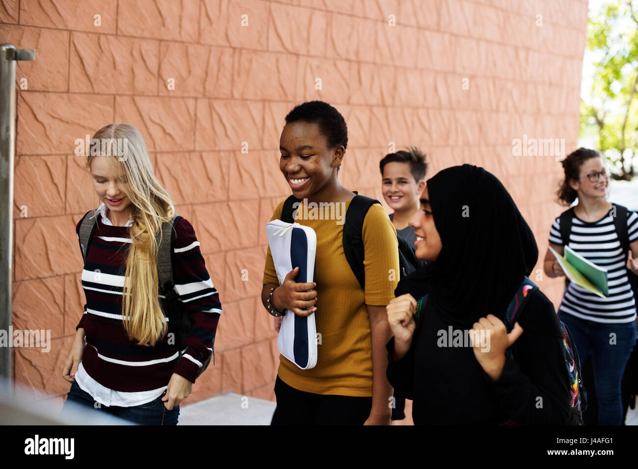 Students walking and talking togetherness Stock Photo - Alamy