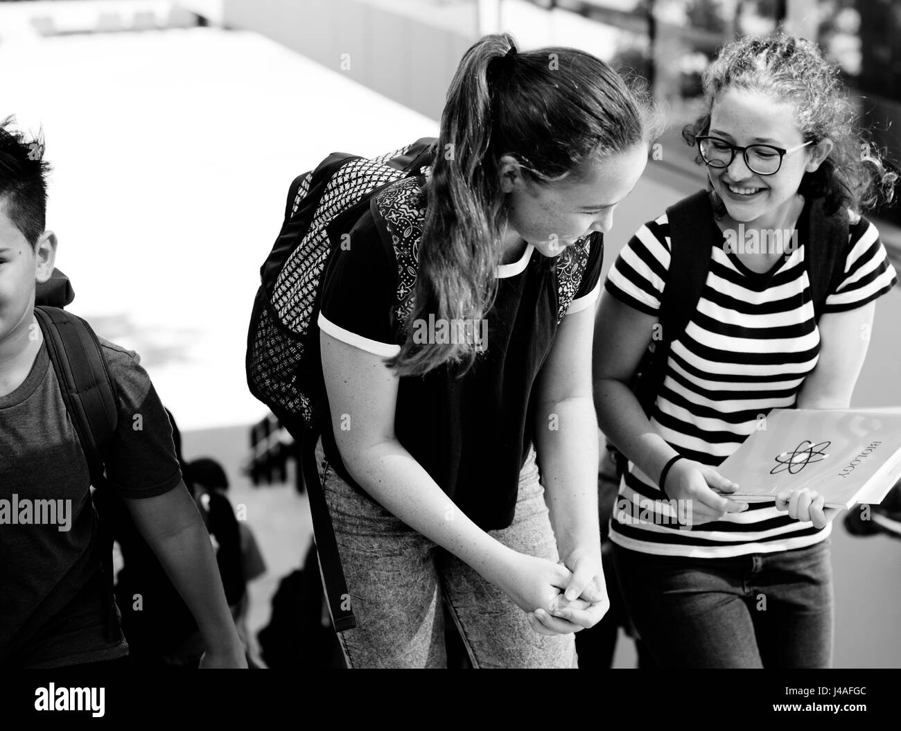 Students walking and talking togetherness Stock Photo - Alamy