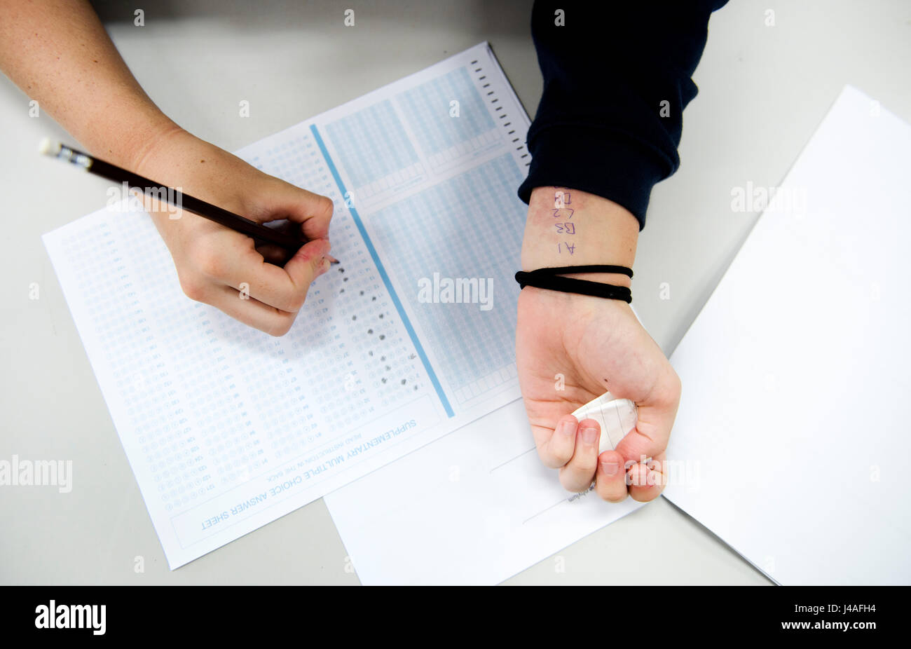 Student cheating examination for the test Stock Photo