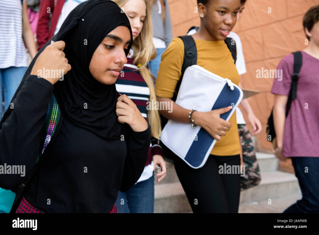 Students walking and talking togetherness Stock Photo - Alamy
