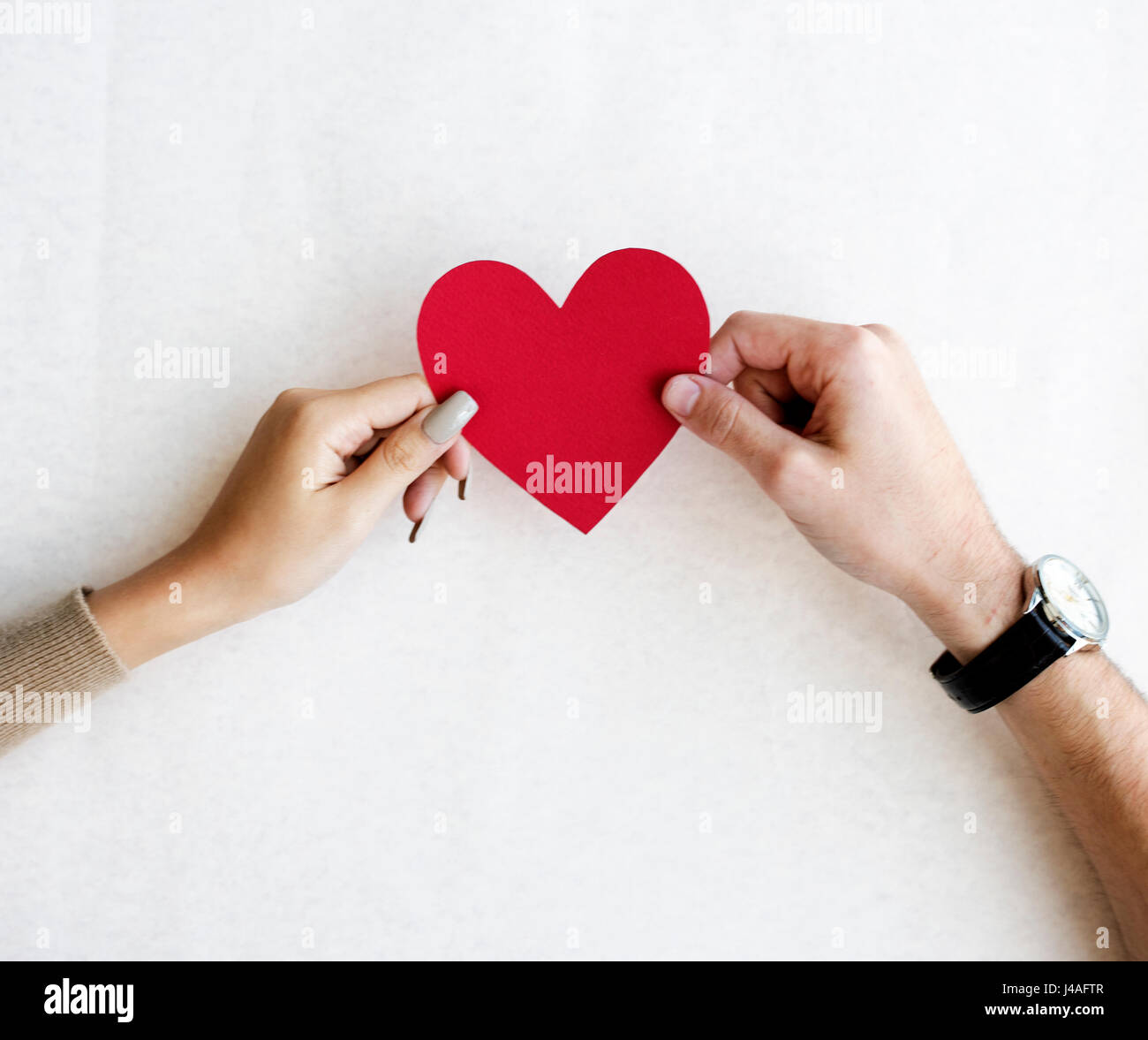 Hands Holding Red Paper Heart Together on White Background Stock Photo ...