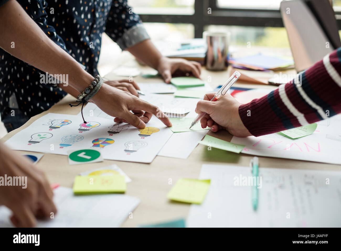 Group of colleagues people brainstorming Stock Photo - Alamy