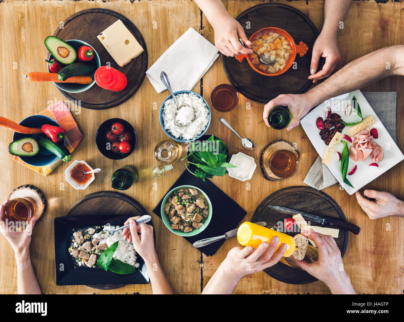 Having Table Top view, Group of people sitting at the wooden table having meal Stock ...