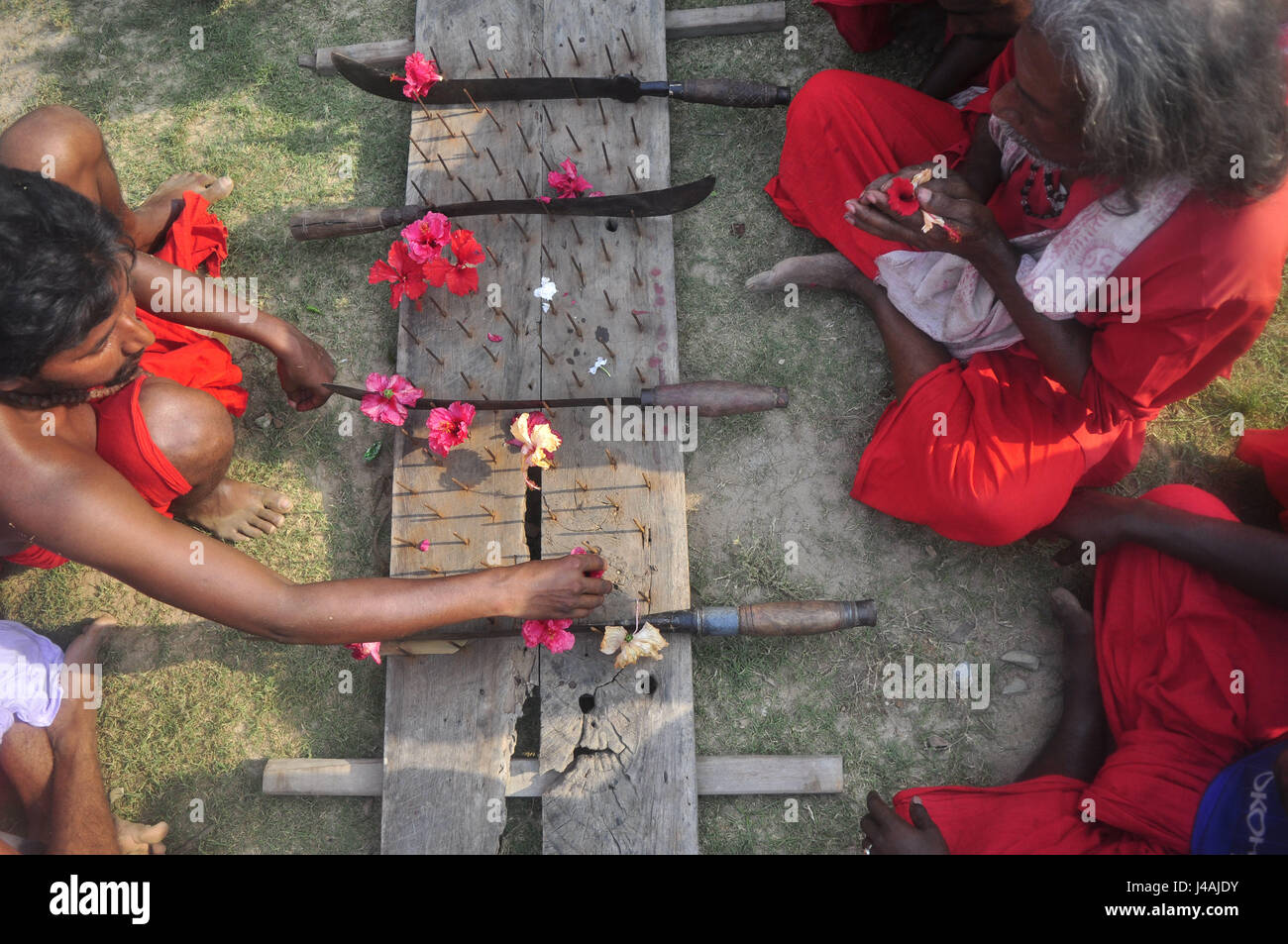 Abhisek Saha / Le Pictorium -  the Festival of Charak is celebrated in the rural areas of Tripura in India -  14/04/2017  -  India / Tripura / Agartala  -  INDIA,TRIPURA-APRIL 14:A Hindu priest is performeing the rituals of Charak Puja  in the outskirts of Agartala, capital of the northeastern state of Tripura.                                                                                   Like every year, the Festival of Charak is celebrated in the rural areas of Tripura on the last day of the Bengali calendar year.The festival which is dedicated to the Hindu deities of Shiva and Sakti invo Stock Photo