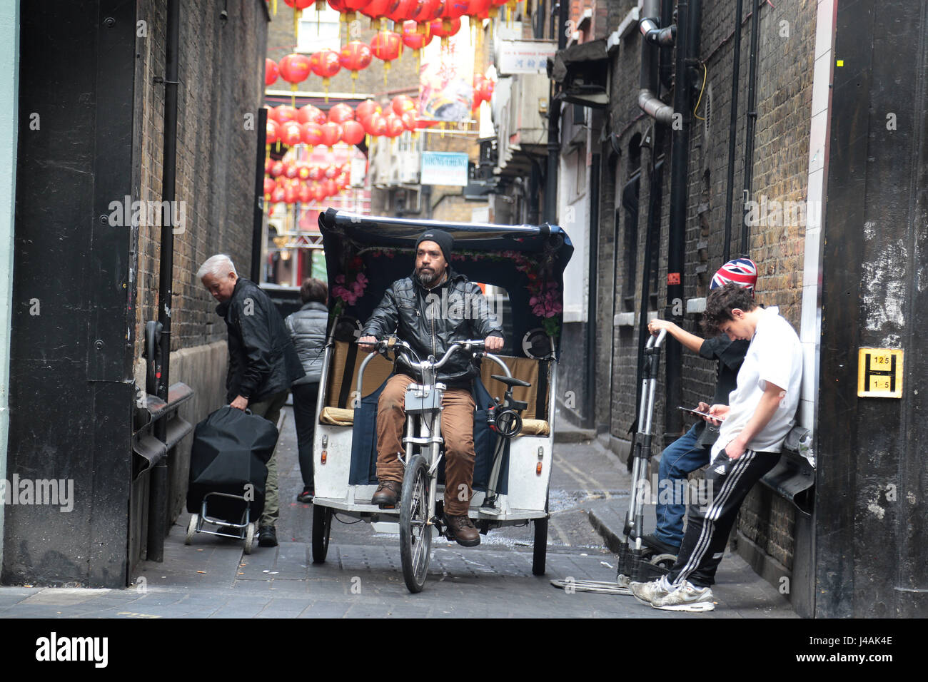 Street Life one back street in Soho watched for ten minutes. Stock Photo
