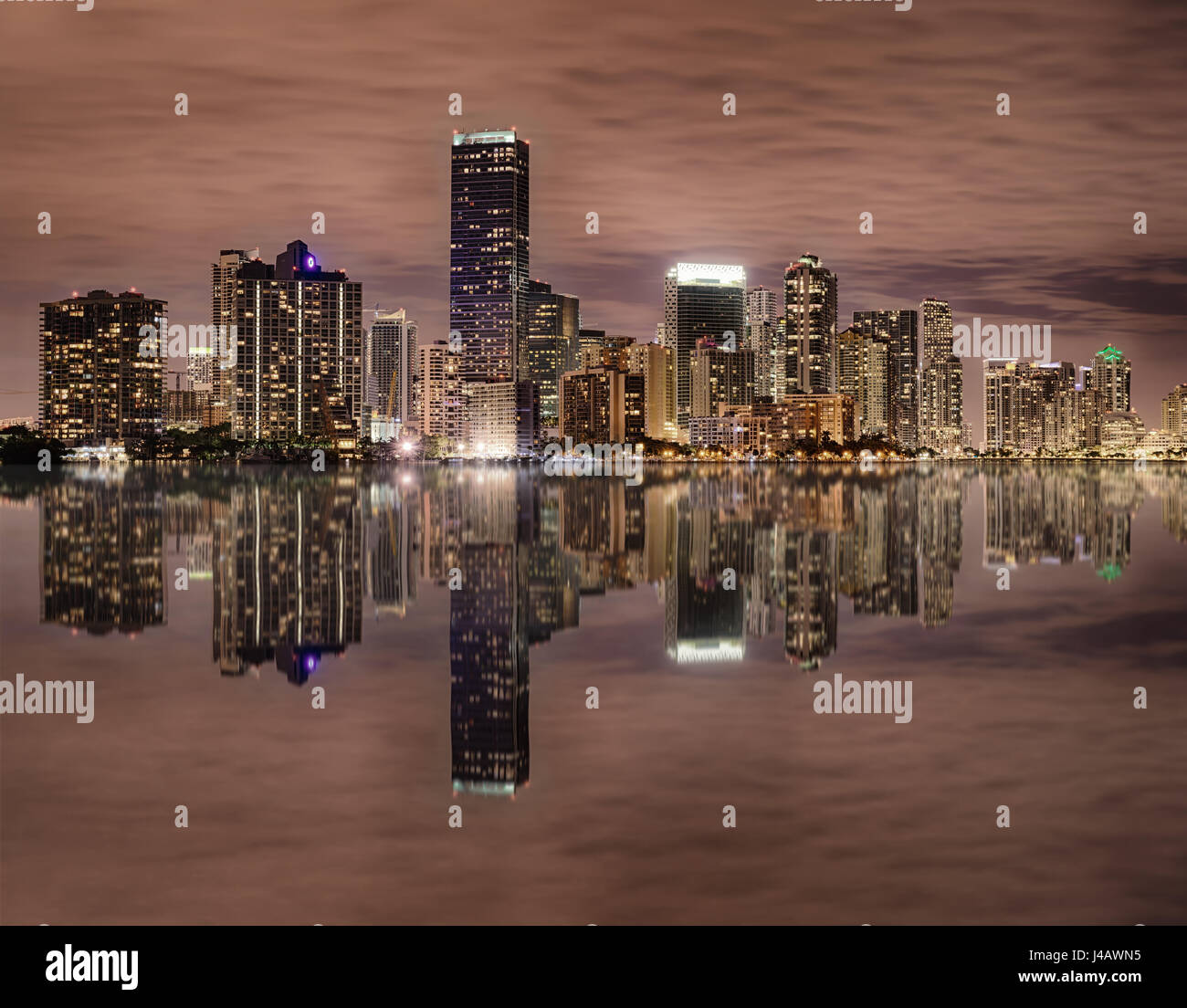 Miami bayfront skyline at night with reflections in water Stock Photo