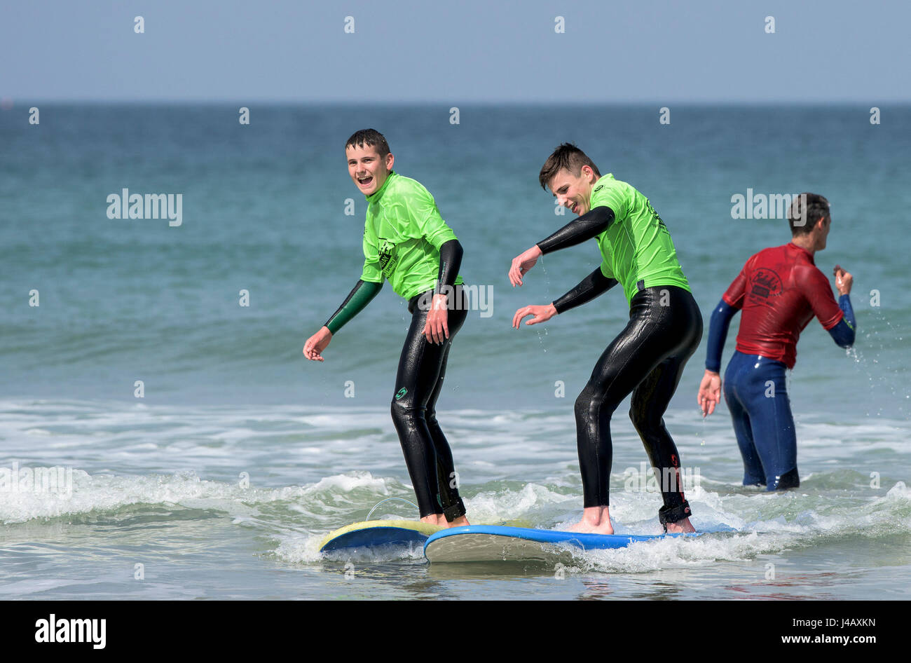 Novices learning to surf on Fistral Beach in Newquay Cornwall Escape