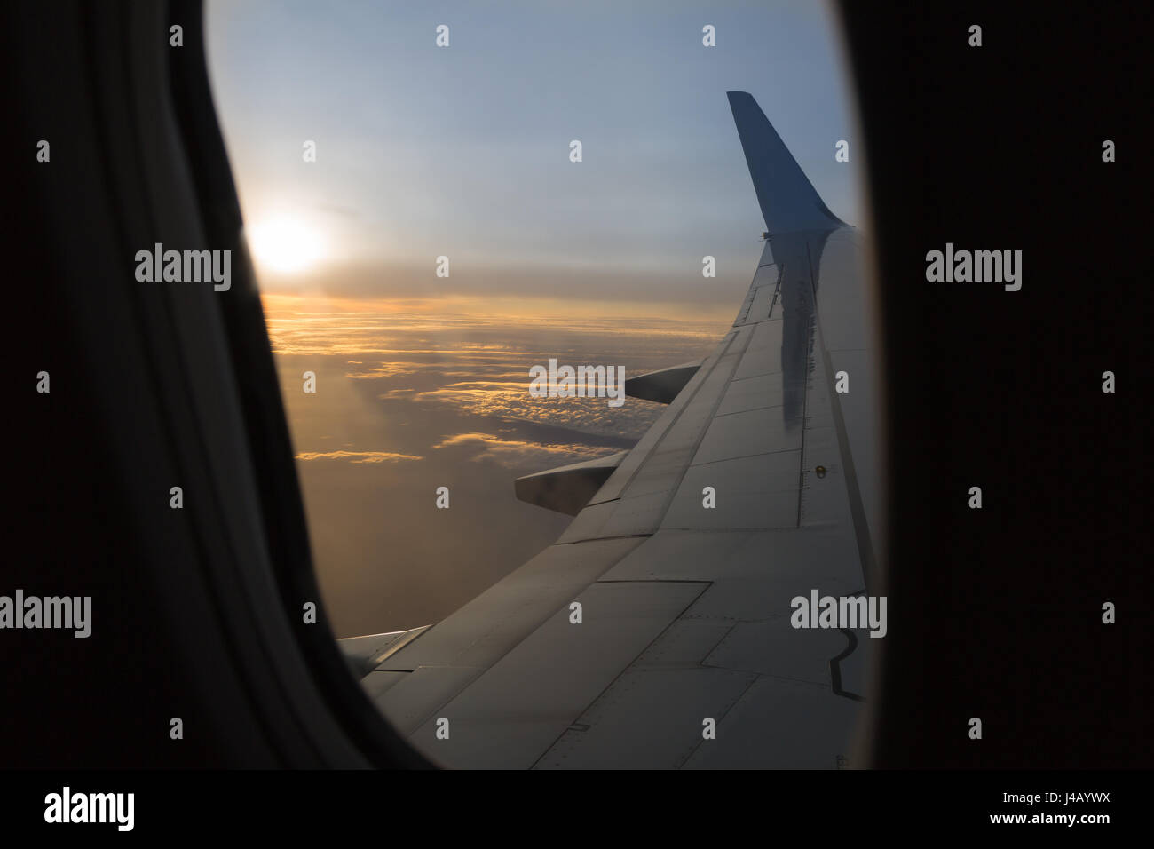 Wing of an Airplane in the Sunset Stock Photo - Alamy