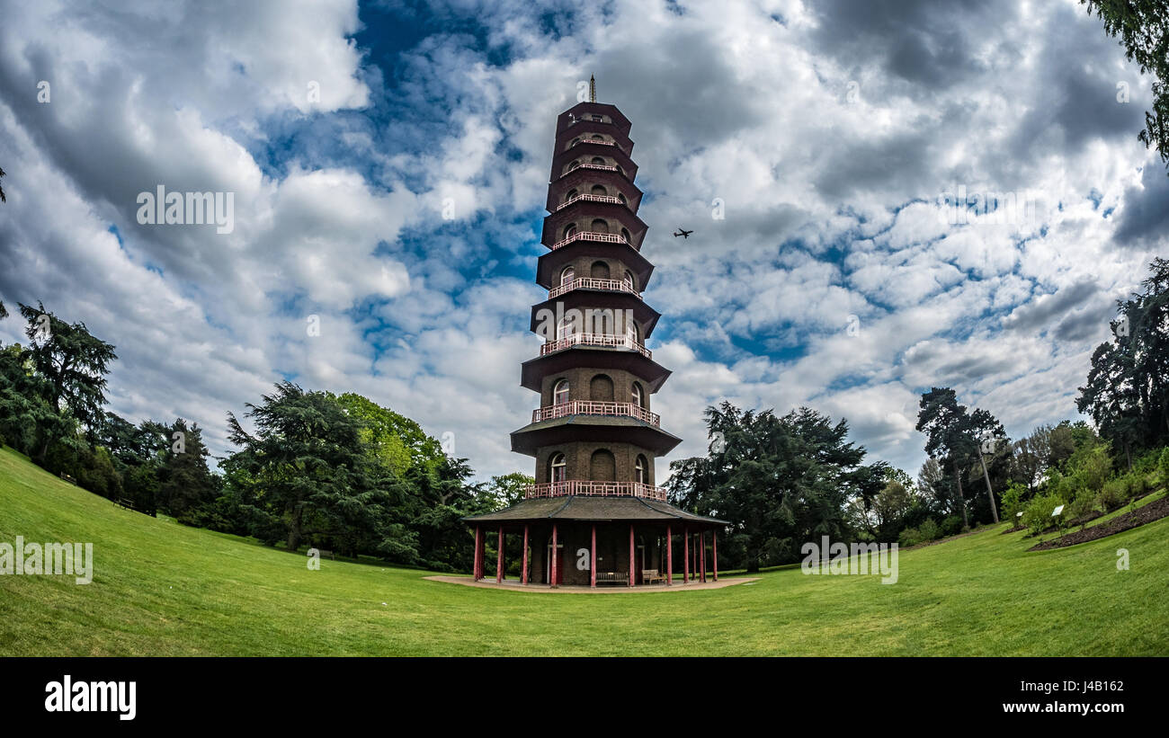 Timelapse view of the pagoda in Kew gardens, London with an airplane flying by Stock Photo