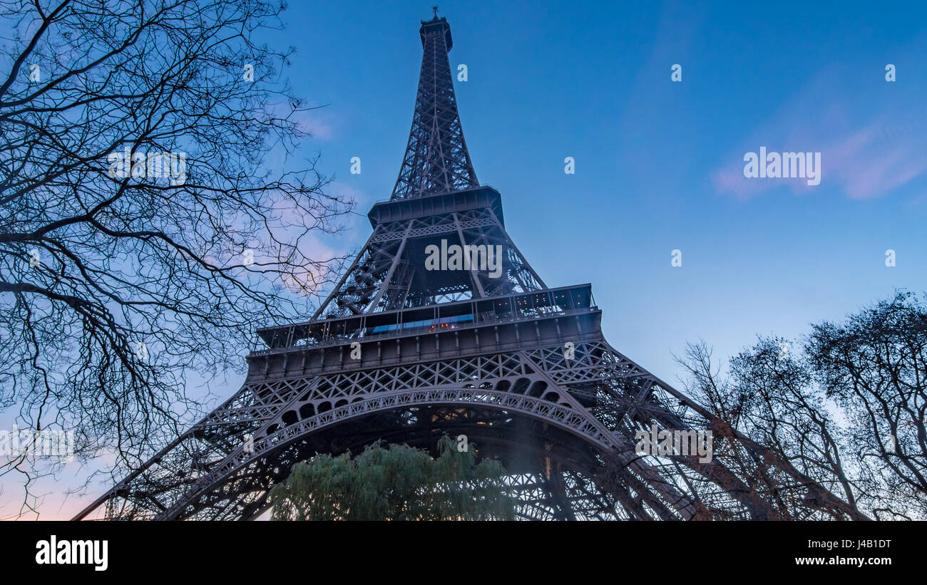 Close up wide angle view of the Eiffel tower in Paris at sunset Stock Photo
