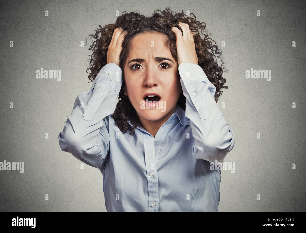 Closeup portrait stressed, frustrated shocked business woman pulling