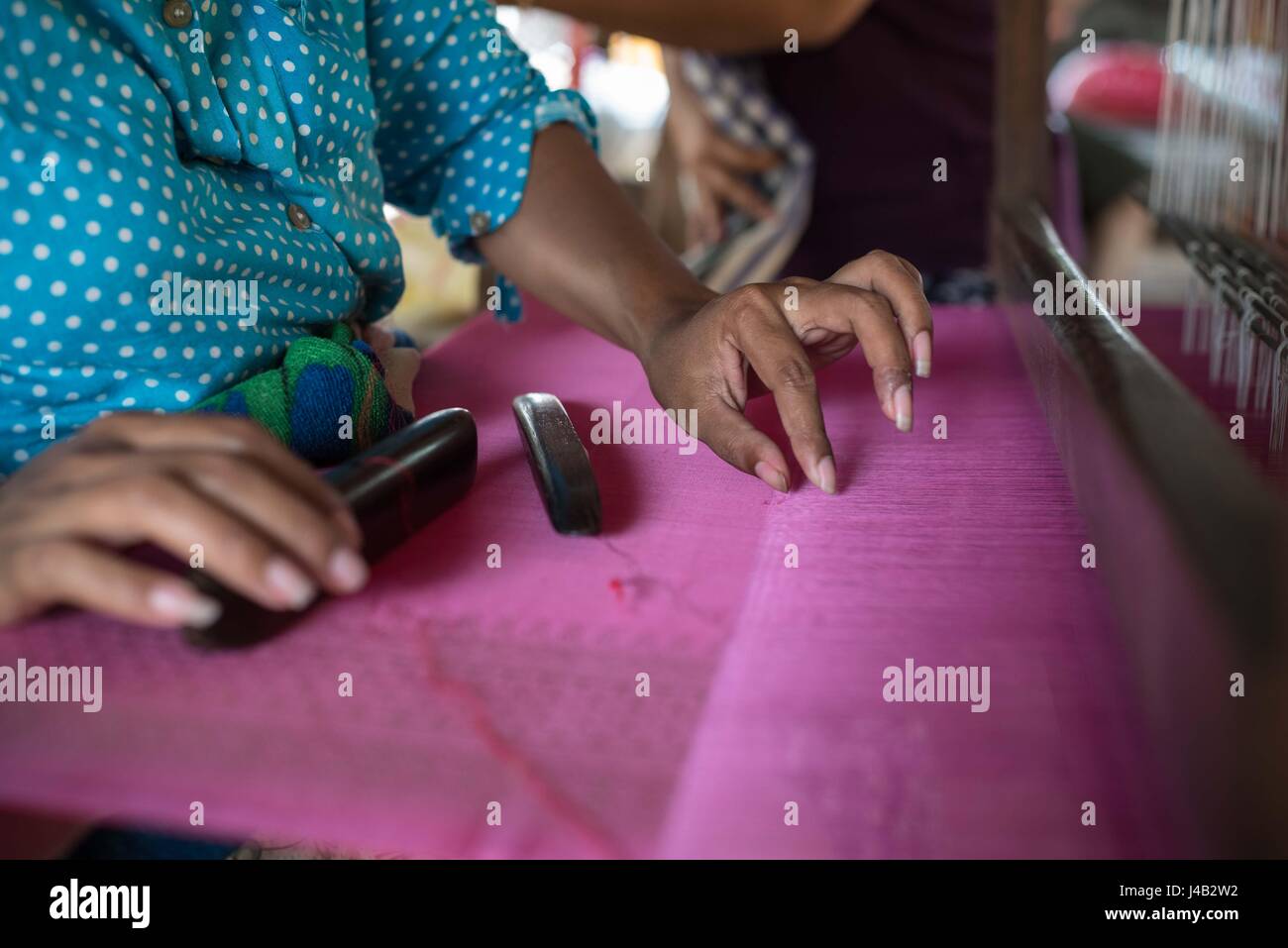 Weavers hands.  Silk Island, Cambodia Stock Photo