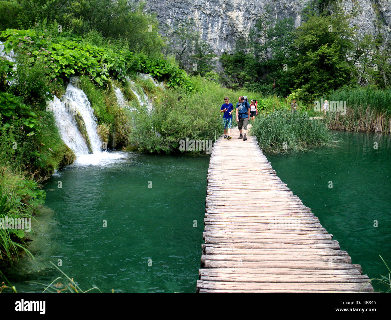 People crossing a walkaway at PLITVICE LAKES, Croatia Stock Photo