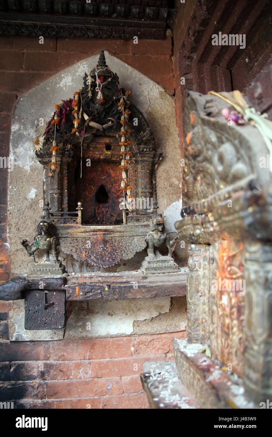 Buddhist shrines in the Hiranyavarna Mahavihara - the Golden Temple - Patan or Lalitpur, Kathmandu Nepal Stock Photo