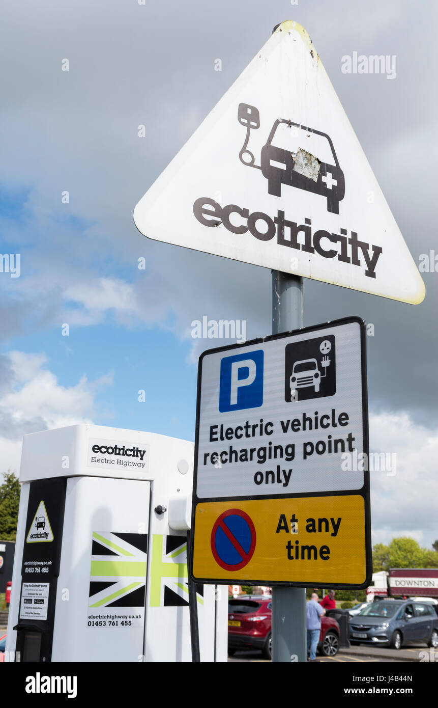Ecotricity sign at an electric car / vehicle charging point at a service station in the UK Stock Photo