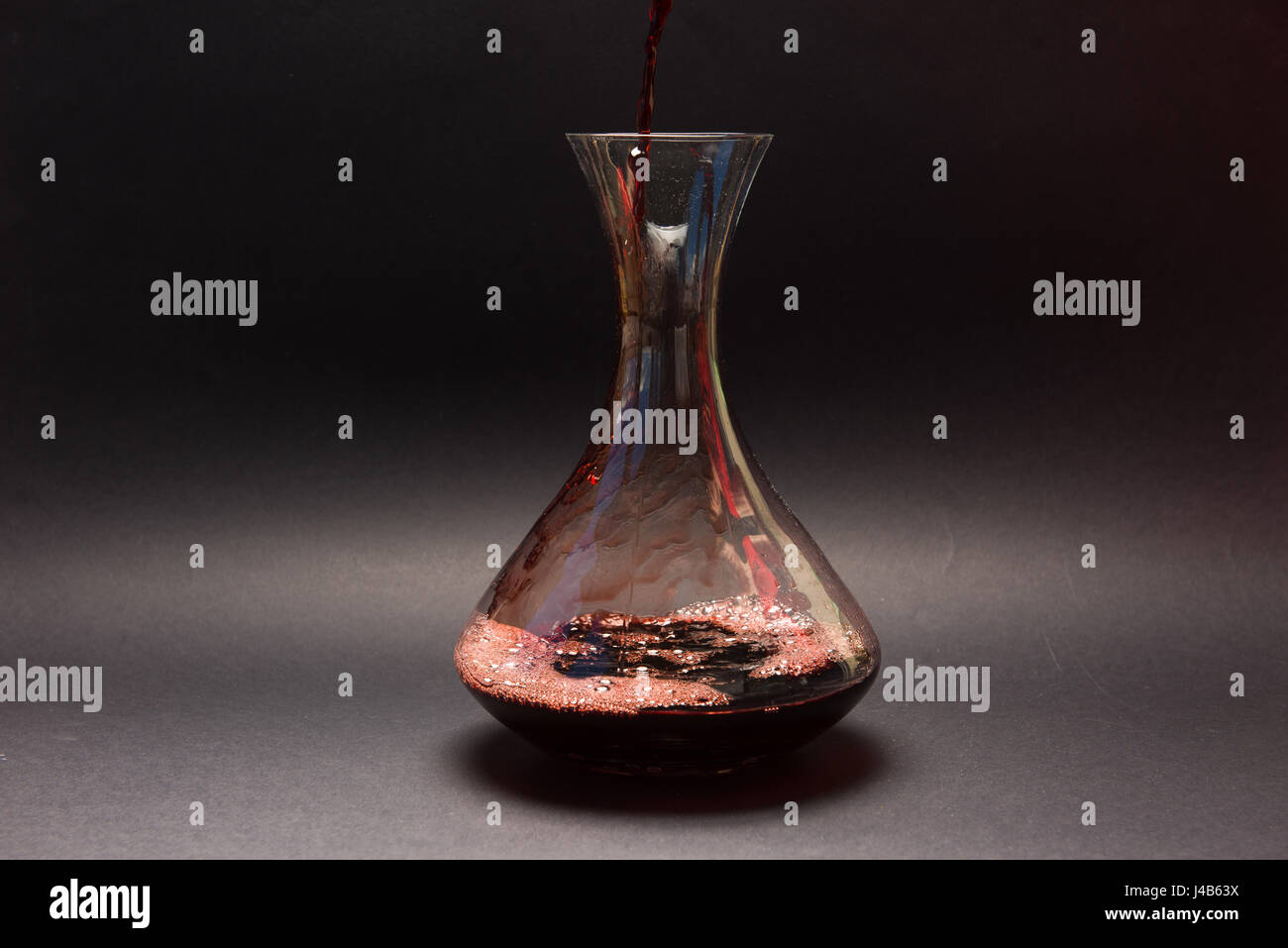 Decanting red wine Stock Photo Alamy