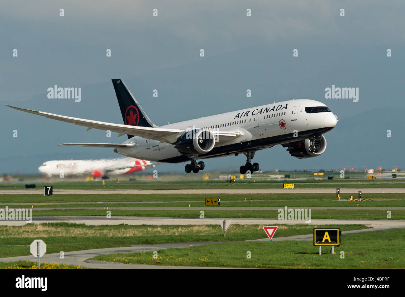 Air Canada plane airplane Boeing 787 Dreamliner painted new livery (2017) take taking off Vancouver International Airport Stock Photo