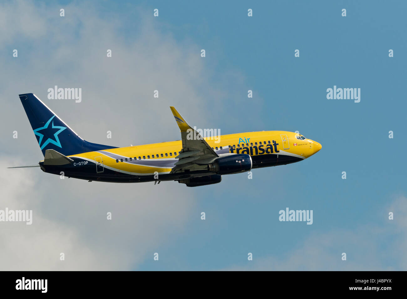 Air Transat plane airplane Boeing 737 airborne after take taking off  Vancouver International Airport Stock Photo