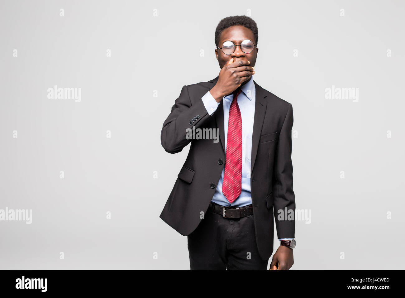 business black man covering his face on grey Stock Photo - Alamy