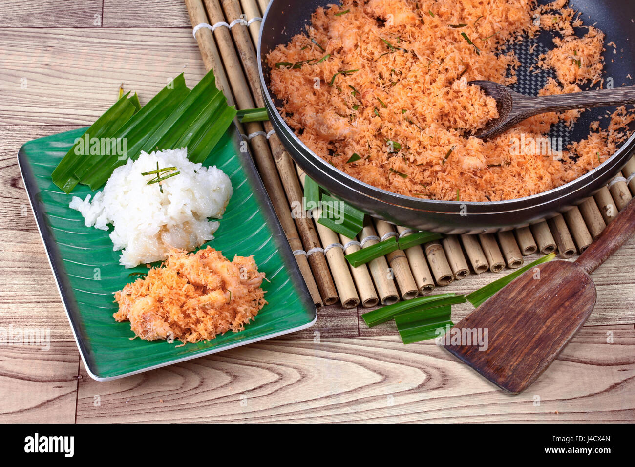 Sticky rice in coconut milk with stirfried grated coconut and shrimp