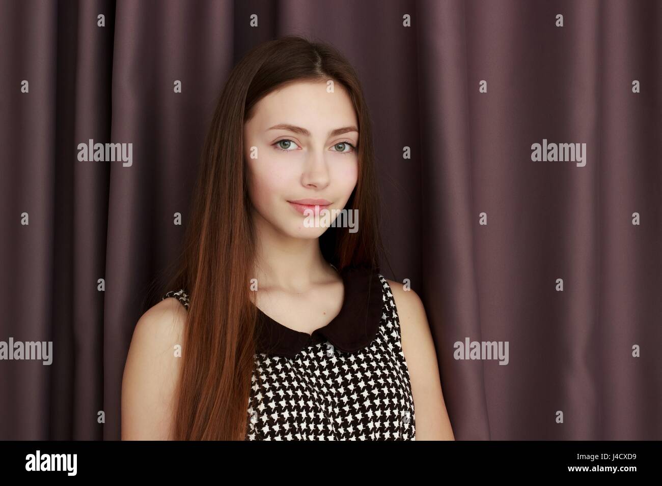 Young woman smiling at camera, portrait Stock Photo