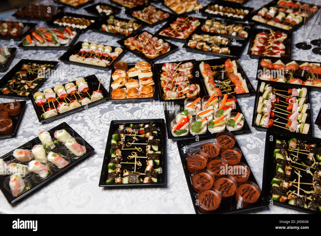 Buffet table with assorted snacks Stock Photo Alamy