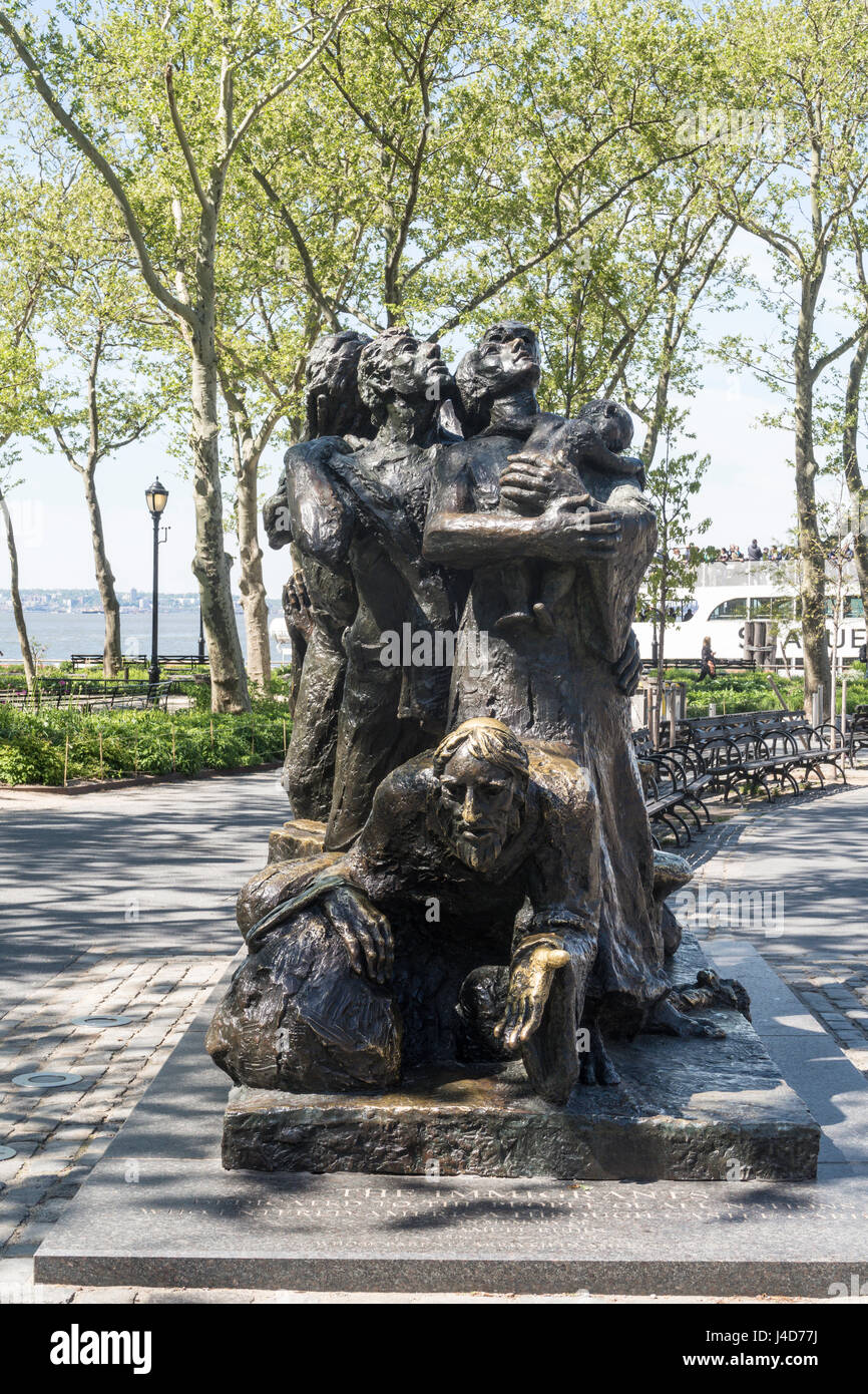 The Immigrants Statue in Battery Park, New York City, USA Stock Photo Alamy