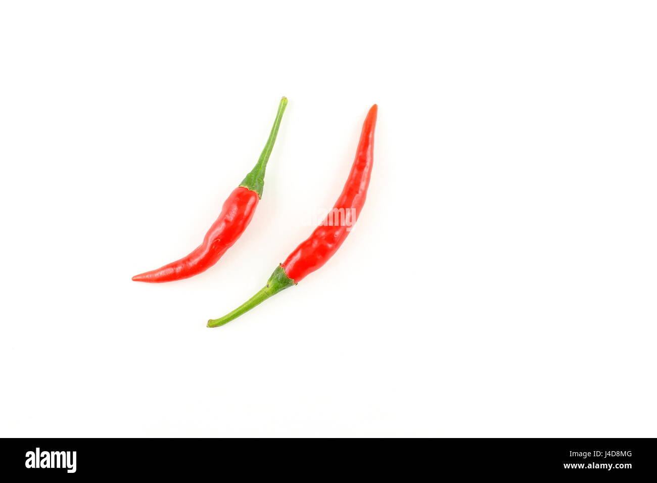 fresh thai chili peppers isolated on a white background as a food background texture Stock Photo
