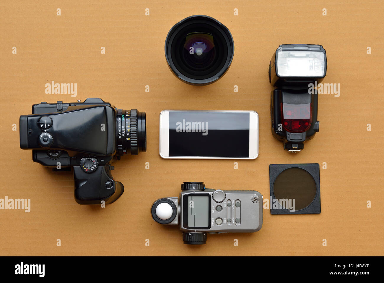 Photography Equipment Shot in Studio on Brown Background Stock Photo