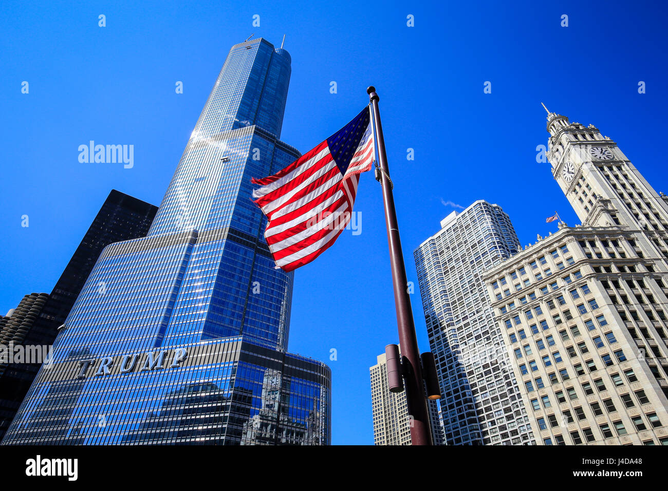 Chicago, American flag in front of Trump Tower Chicago and Wrigley Building, Chicago, Illinois, USA, North America, Amerikanische Fahne vor Trump Towe Stock Photo