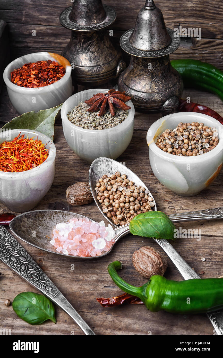 large set of Indian spices in spoons and bowls Stock Photo