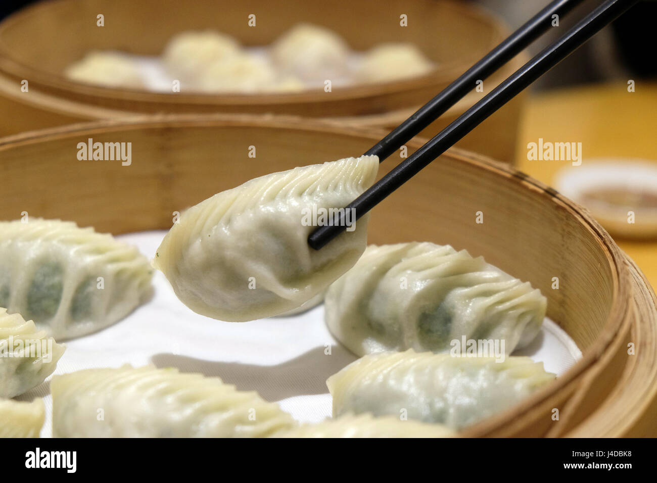 Chinese steamed dumpling in Bamboo Steamer, commonly eaten in East Asia in Beijing, China, February 23, 2016. Stock Photo