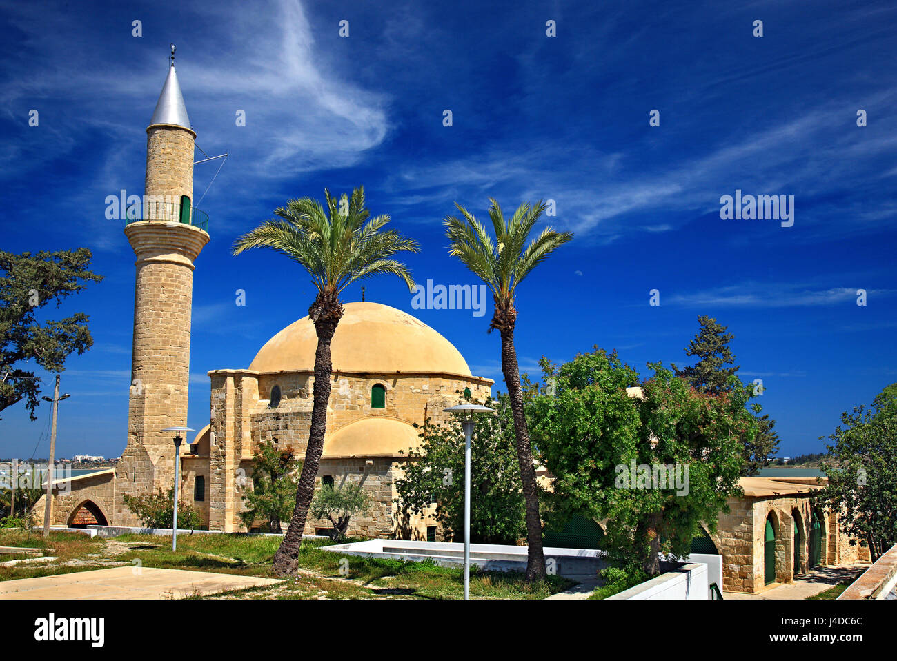 Hala Sultan Tekke (or 'Mosque of Umm Haram' - a very important and very sacred place for Islam) at the salt lake ('Alyki') of Larnaca, Cyprus Stock Photo