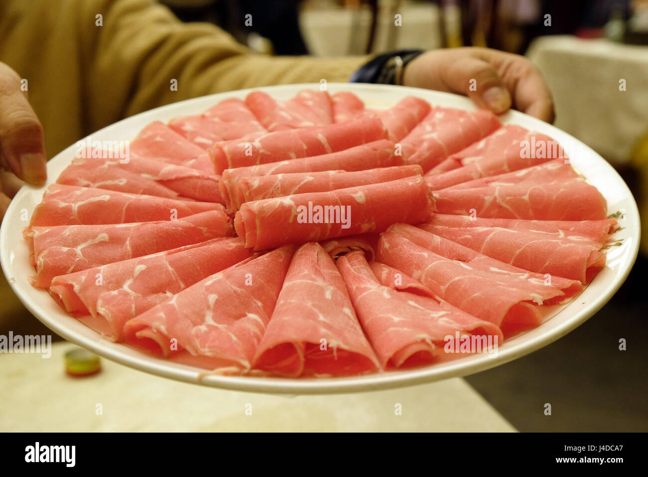 Mutton prepared for cooking in the hot pot, in Beijing, China, February 24, 2016. Stock Photo