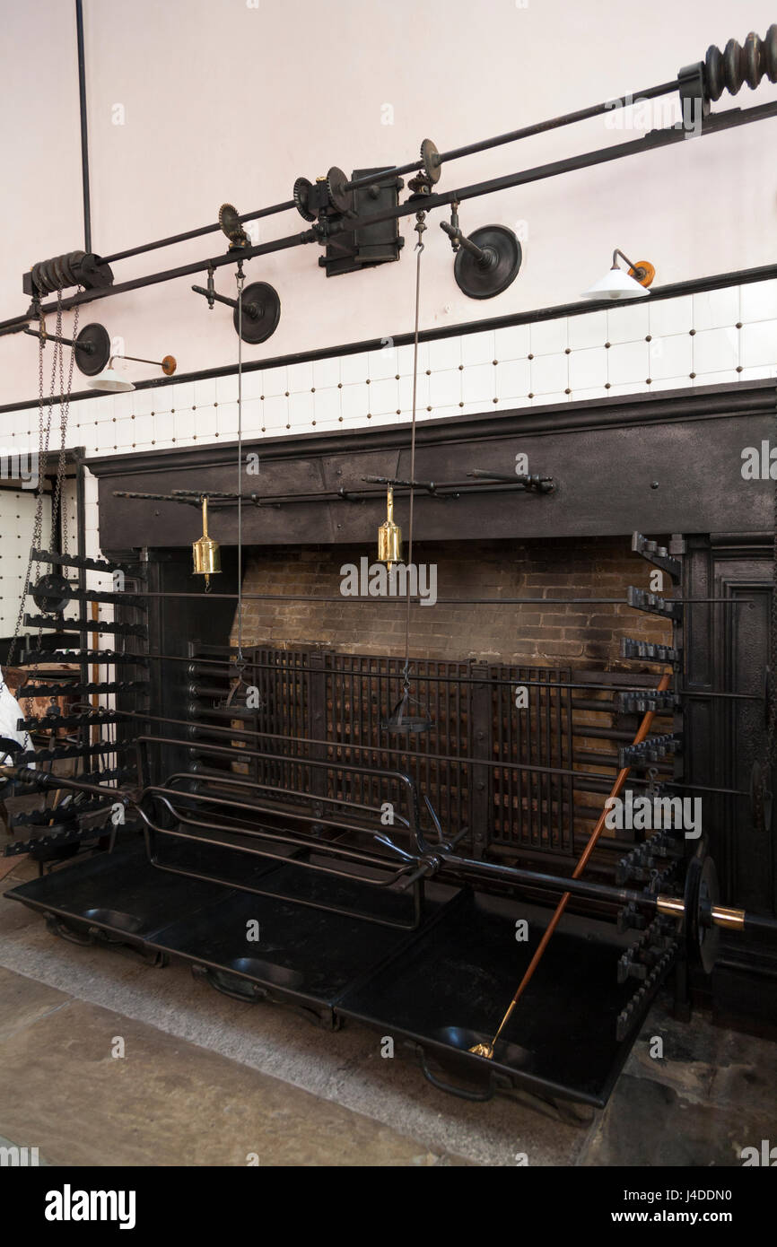 Spit rotisserie / mechanical turnspit / fireplace / roasting spits / in stately home kitchen, Bodmin, Cornwall. (70) Stock Photo