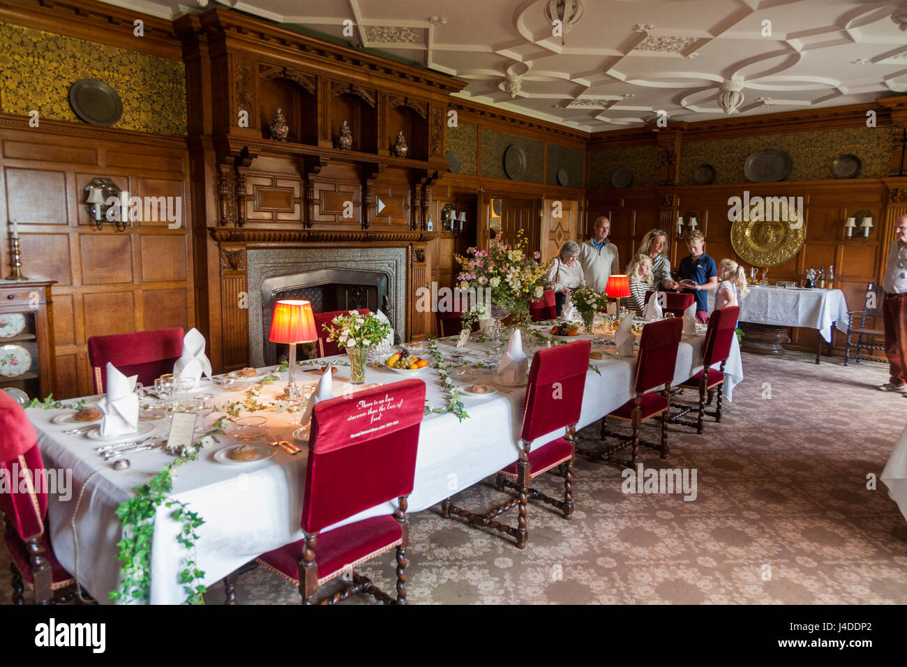 Formal dining room with set table ready for a meal at Lanhydrock, Bodmin, Cornwall. (70) Stock Photo