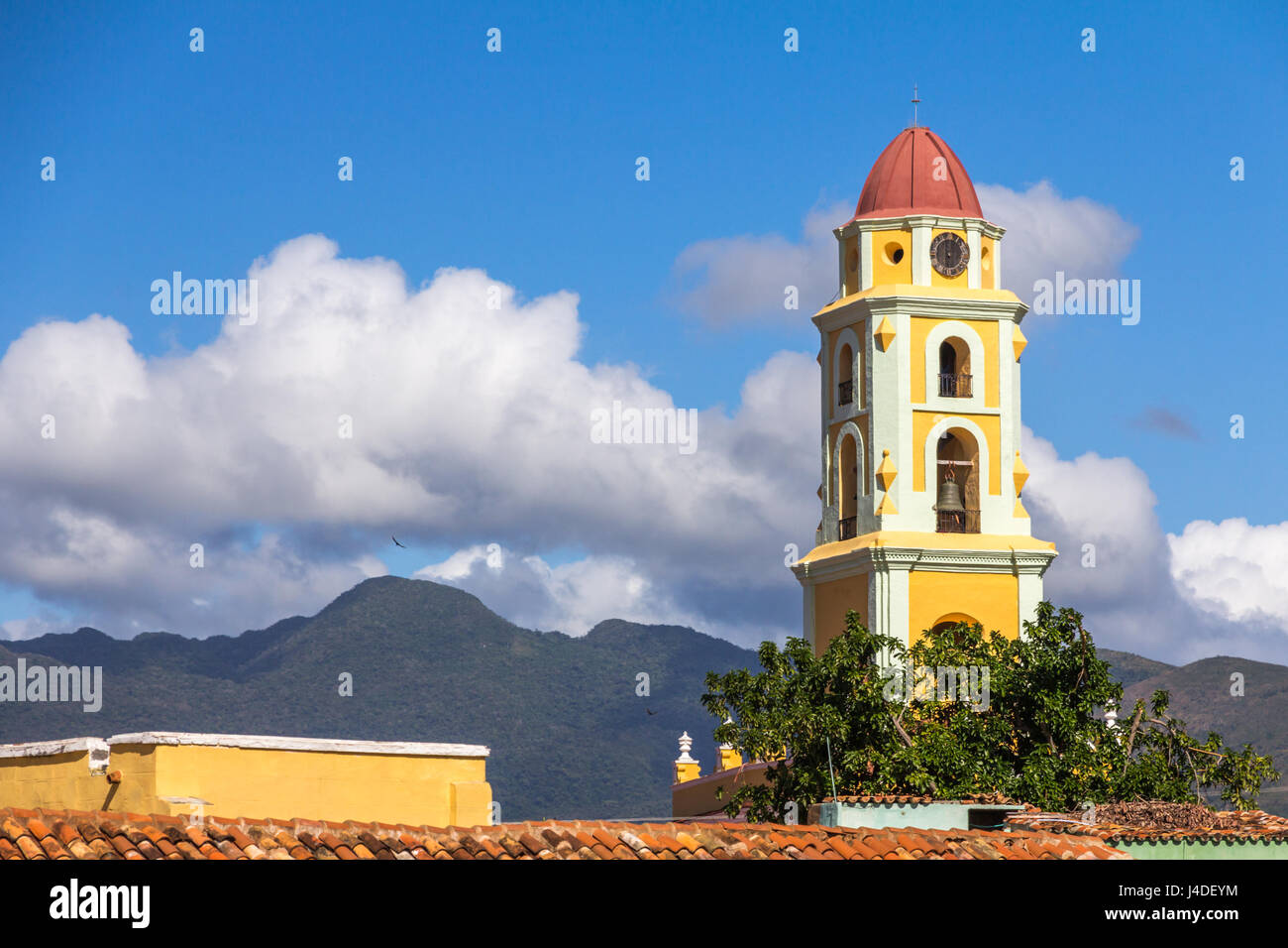 Trinidad's iconic yellow-and-white belltower topped with marsala-coloured dome. Tower was formerly the Church and Convent of San Francisco de Asis Stock Photo