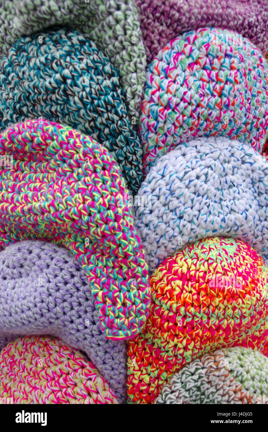 The handmade wool caps in variegated colors Stock Photo