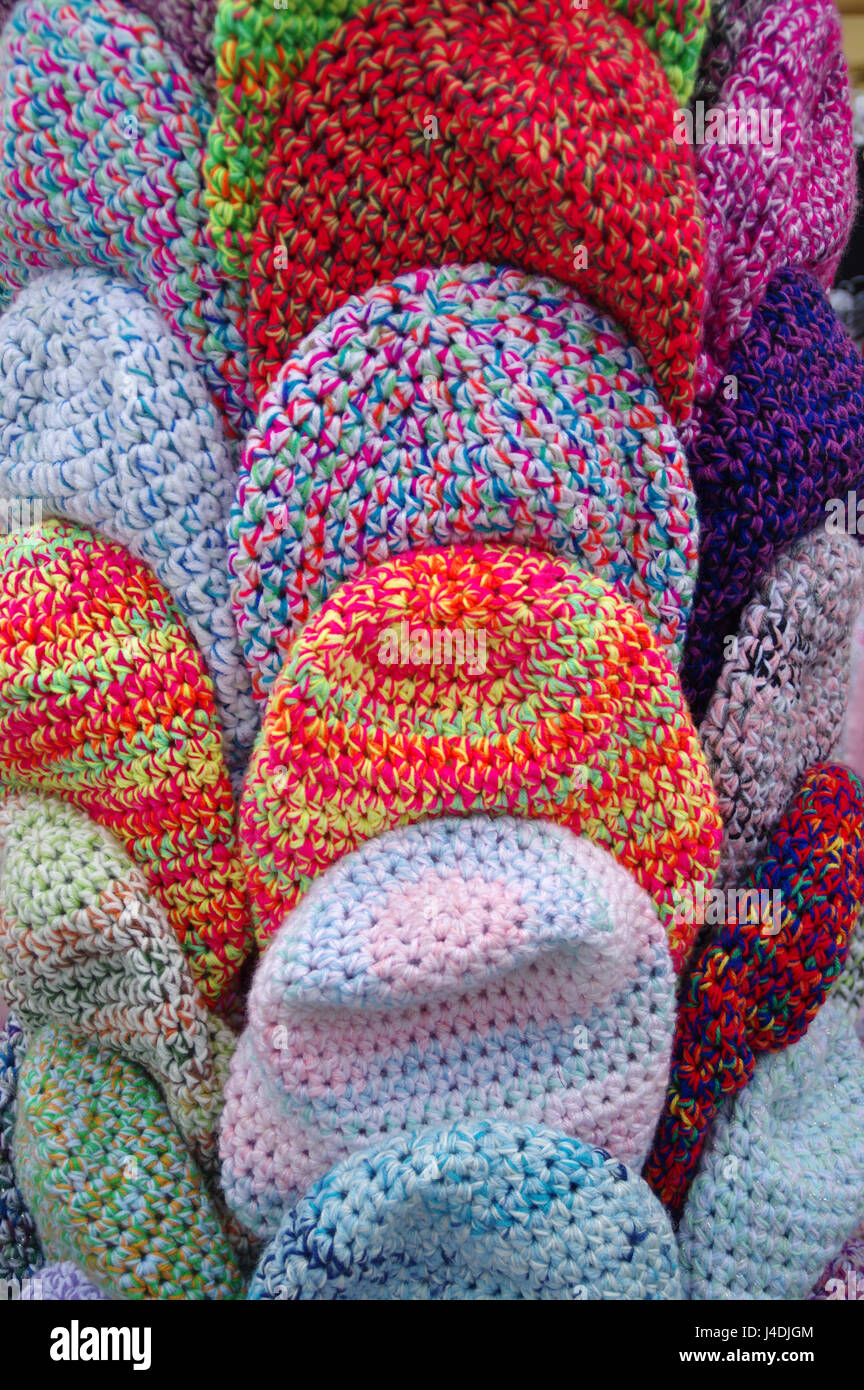 The handmade wool caps in variegated colors Stock Photo