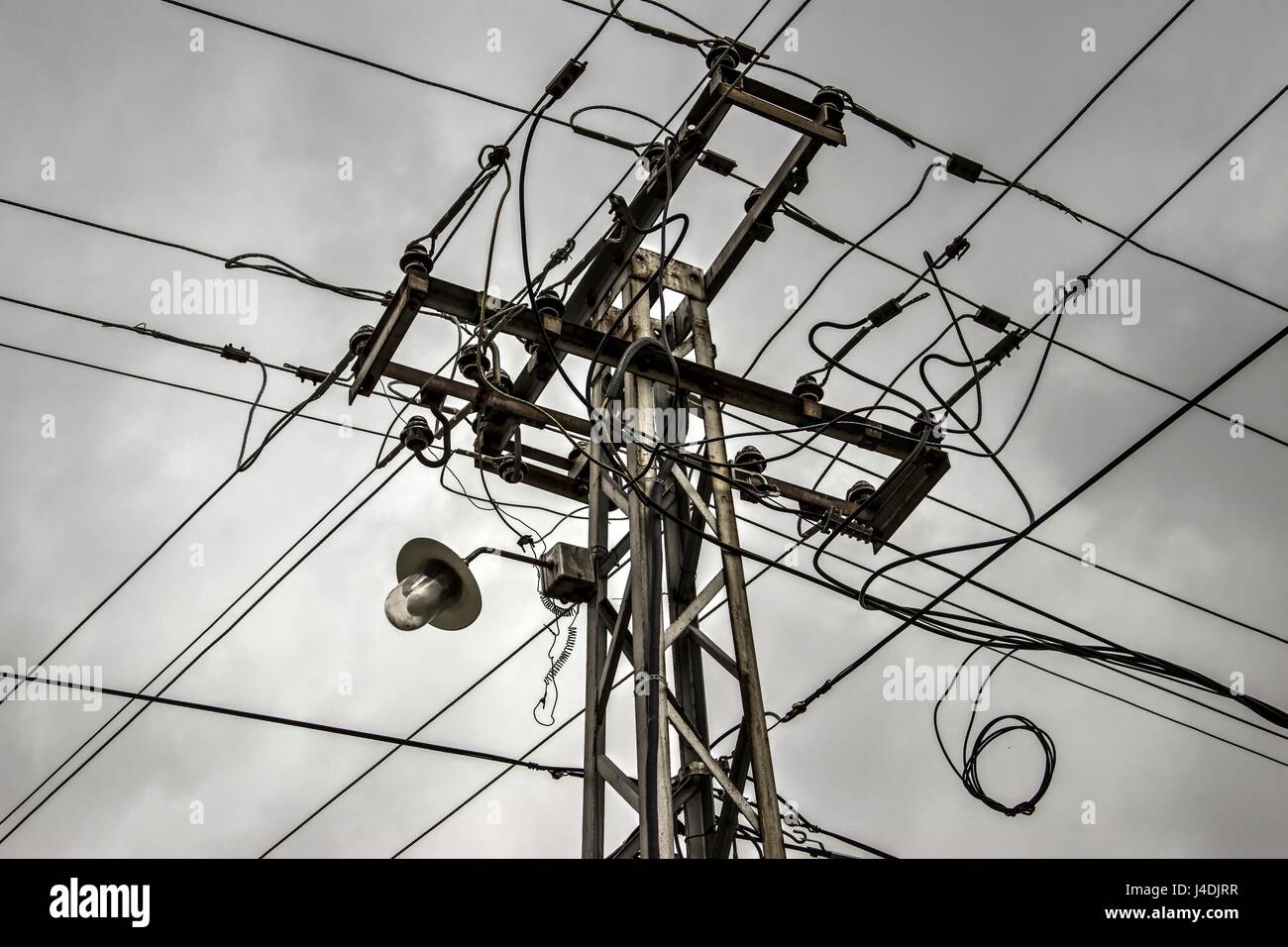 Utility power pole supporting wires Stock Photo