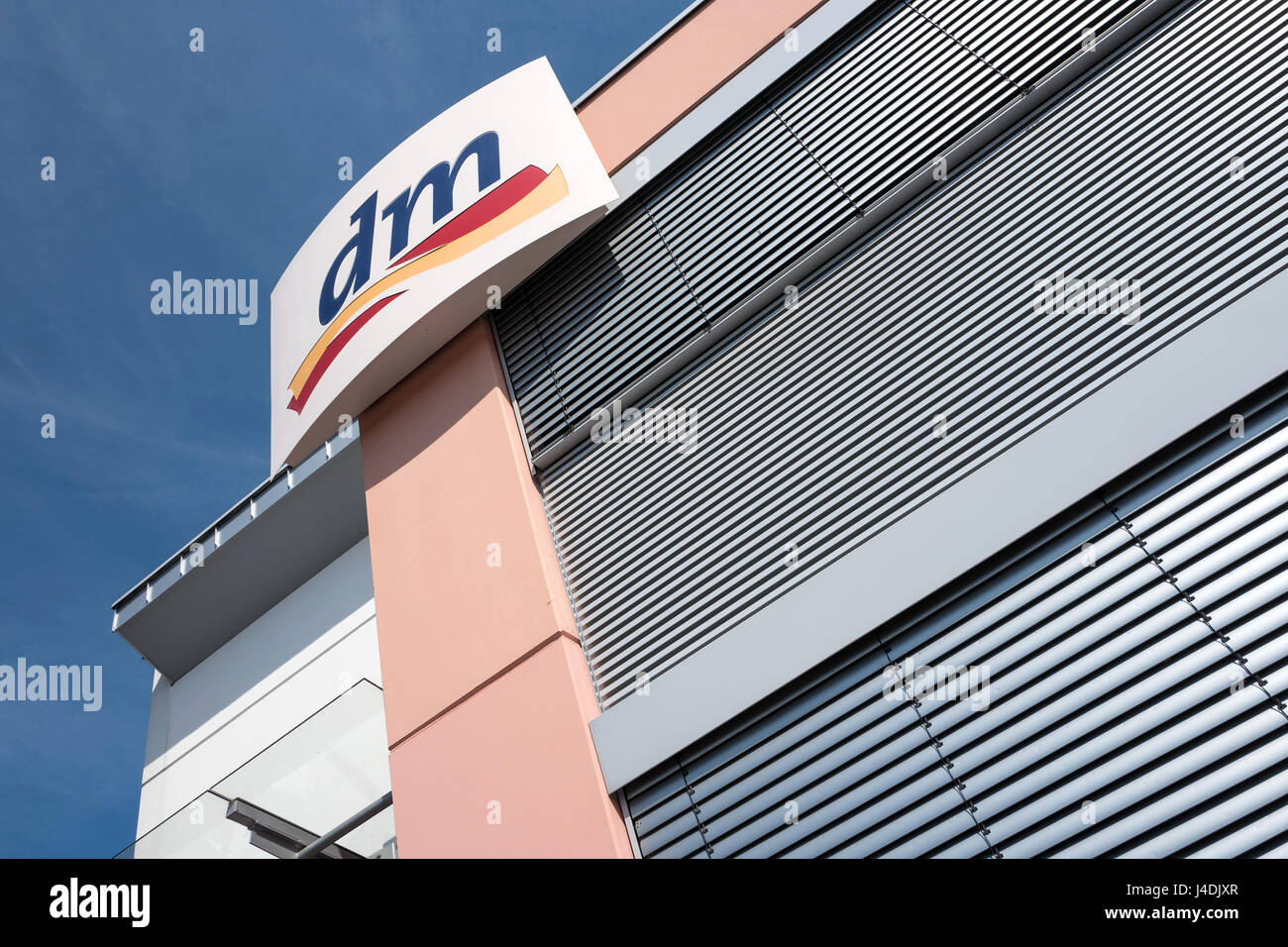 dm sign at branch. dm-drogerie markt is a German chain of retail stores, that sells cosmetics, healthcare items, household products and health food. Stock Photo