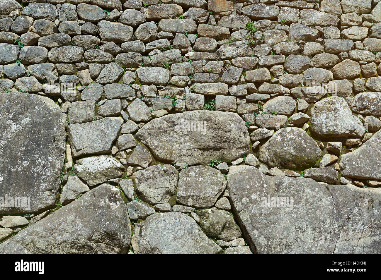 Old stone wall background. Natural rock abstract pattern Stock Photo