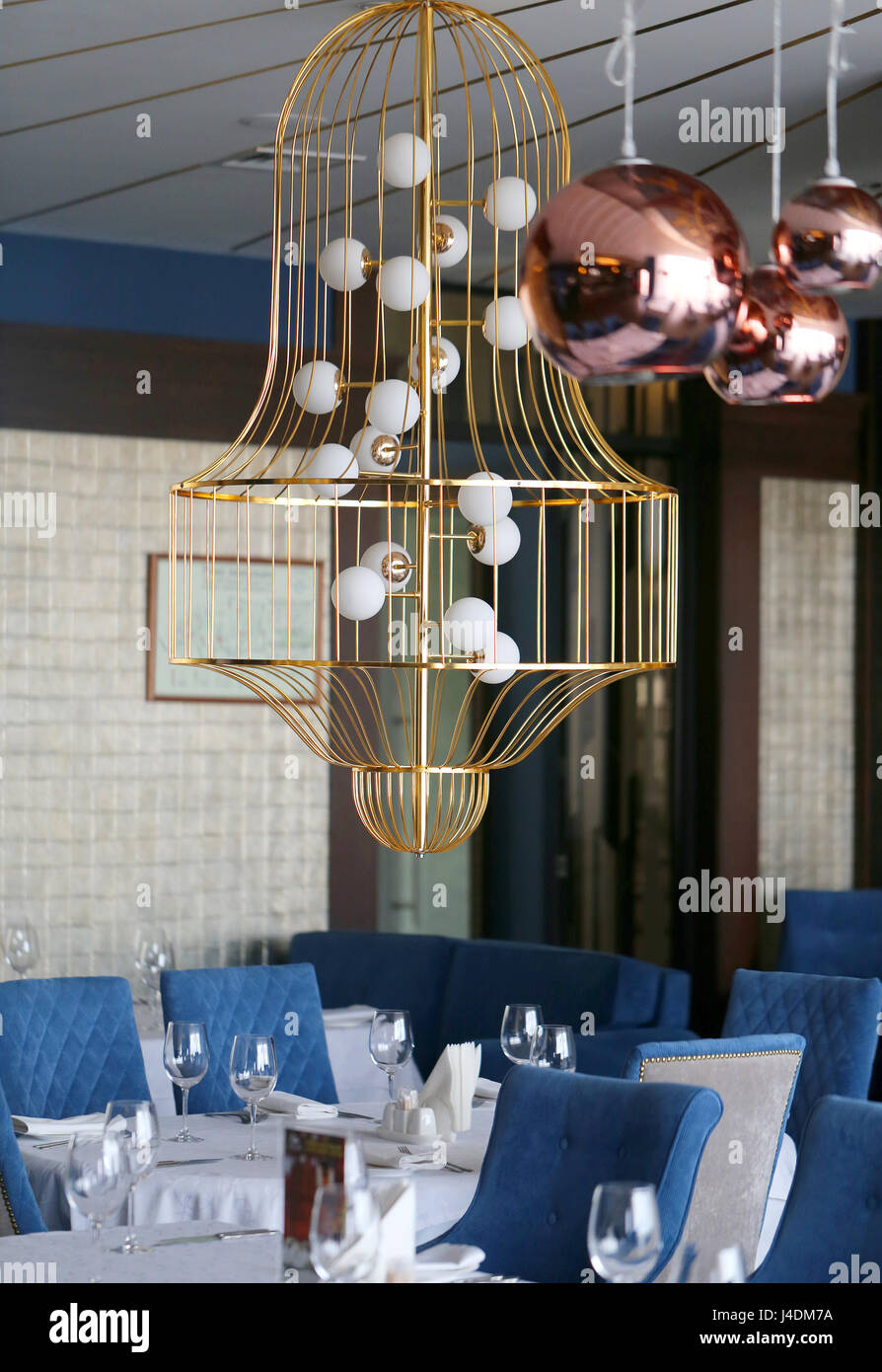 Beautiful interior in the restaurant, the chandelier and decorated ...