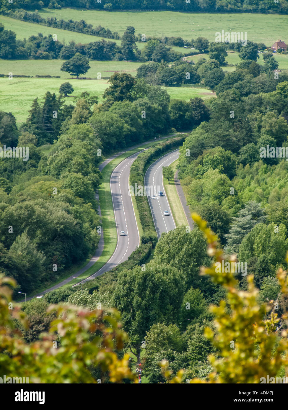 View of A24 main road winding through countryside from the top of Box Hill, nr Dorking, Surrey, England Stock Photo