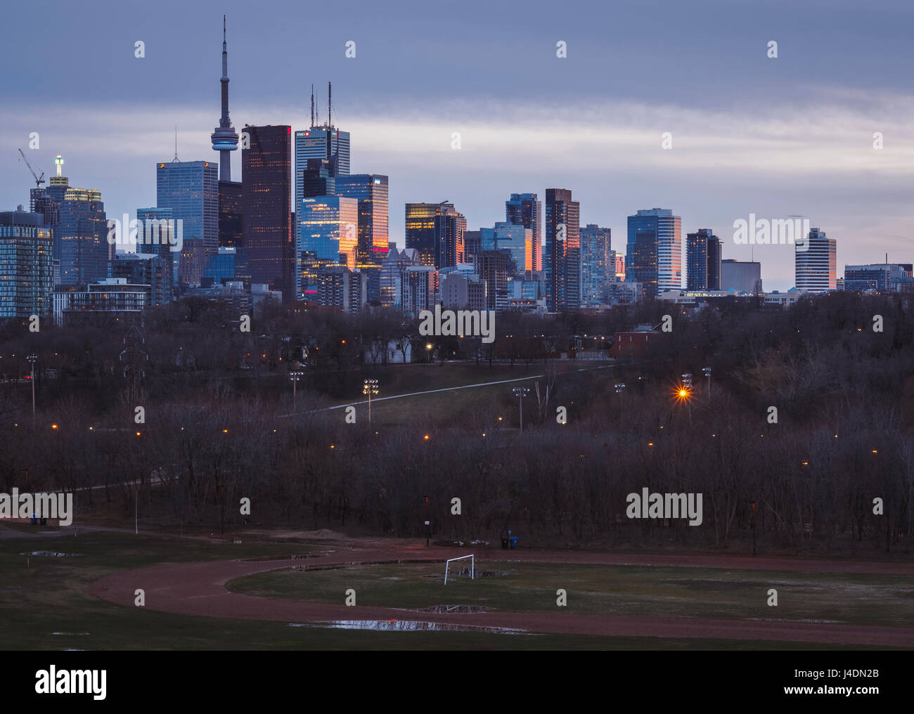 Toronto Skyline from Riverdale park showing sun reflections on the buildings during the blue